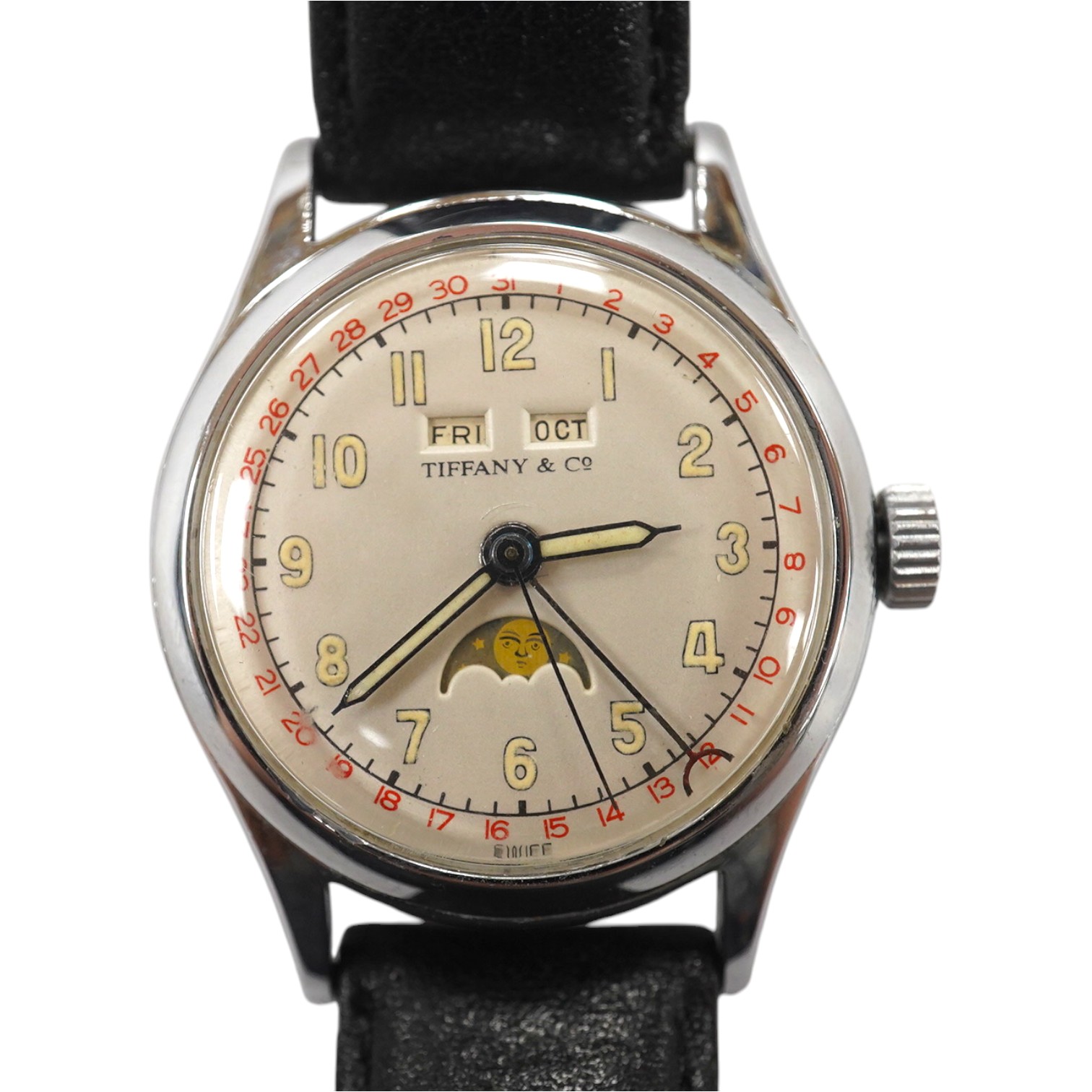 A gentleman's 1940's? steel calandar moonphase manual wind wrist watch, the dial inscribed Tiffany & Co, with Arabic dial and day/date apertures, case diameter 33mm, on a later associated leather strap, movement unsigned